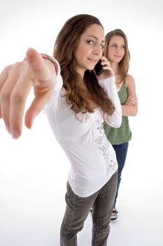 teenager beautiful young girls posing with hand gesture against white background