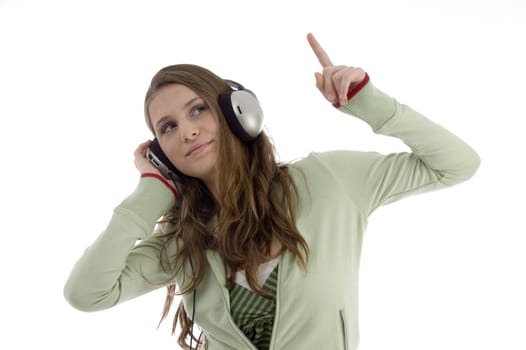 woman in dancing posture while listening music isolated with white background