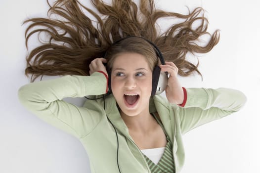 woman taking the pleasure of music on an isolated white background