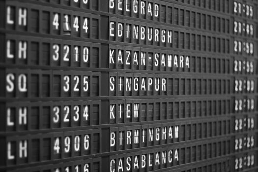 flight schedule display in airport, shallow DOF