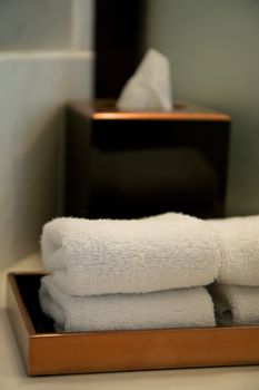 pile of towels in a hotel bathroom, shallow DOF