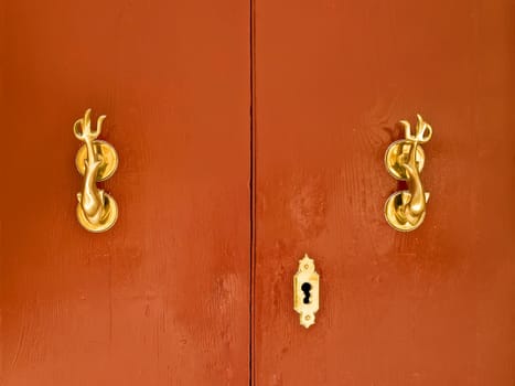 Red door with gold fittings in Mdina in Malta