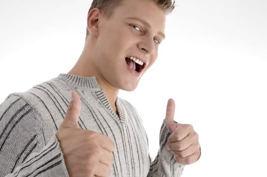 handsome man showing thumbs up on an isolated background