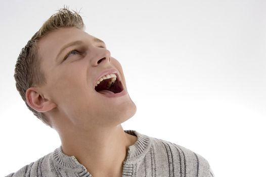 laughing young man against white background