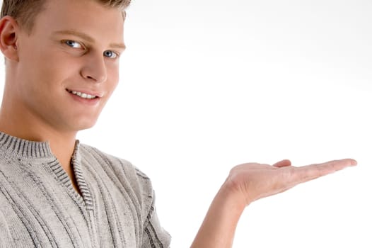 smiling man with open palm on an isolated background