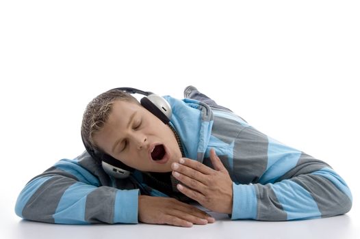 yawning man with headphone on an isolated white background