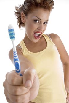 woman with tooth brush on an isolated white background