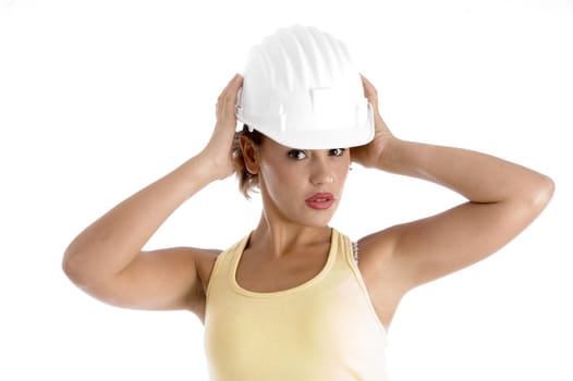 woman with architect helmet against white background