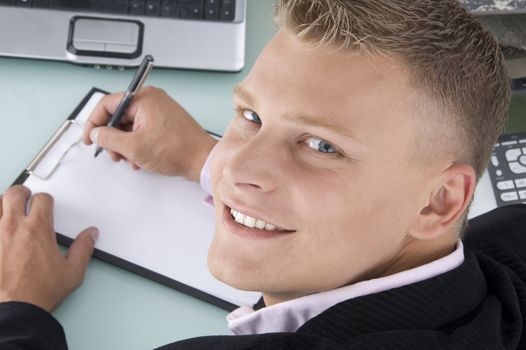 back pose of smiling lawyer with pen and writing board with white background