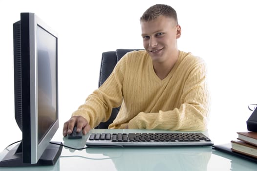 smiling man working on computer on an isolated white background