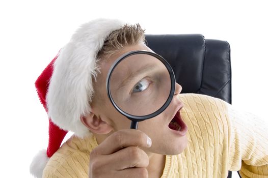 man wearing santa hat and looking through lens on an isolated background