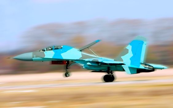 Fighter Su-34 take-off from a airdrome. Panning effect