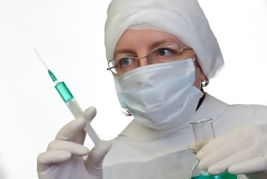 female doctor whit syringe in white coat