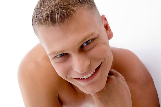 close up of smiling muscular man with white background