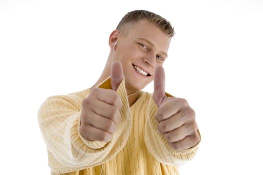 handsome man showing good luck sign with both hands on an isolated white background