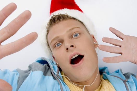 scared young man with christmas hat on an isolated white background