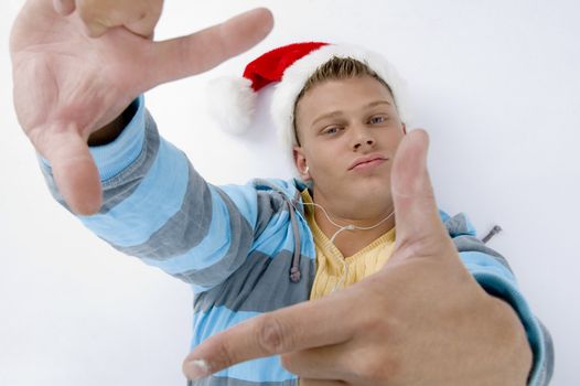 man wearing christmas hat and showing christmas hat with white background