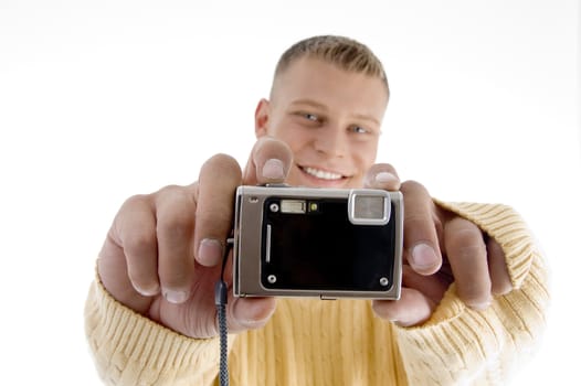 portrait of man showing camera with white background