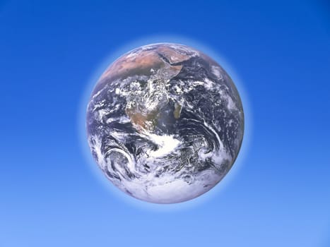 The Earth over a clear blue sky backdrop