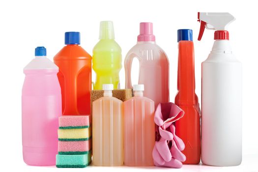 Colored plastic detergent bottles with sponges and gloves isolated on white background with clipping path