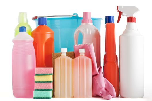 Colored plastic detergent bottles with bucket, sponges and gloves isolated on white background with clipping path