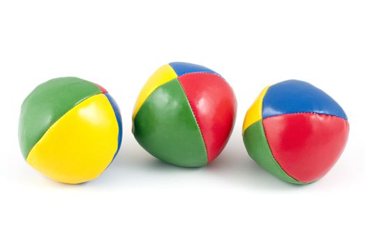 Three colorful juggling balls isolated on white background.