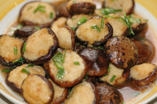 Delicious Asian Chinese cuisine of fish paste stuffed mushroom with parsley