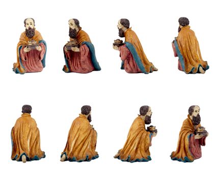 Christmas crib isolated on white statuettes representing a King.