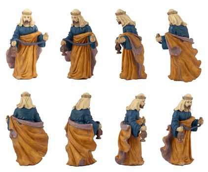 Christmas crib isolated on white statuettes representing a King.