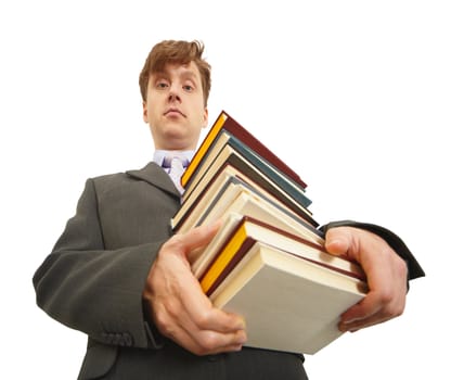 Waggish young man holding a big pile of textbooks