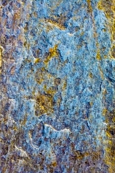 Surface of a raw dark blue stone - a natural background