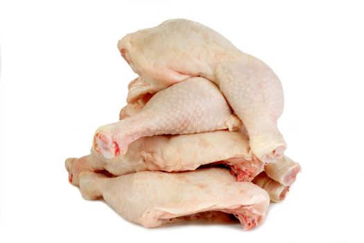 Raw chicken legs on bright background