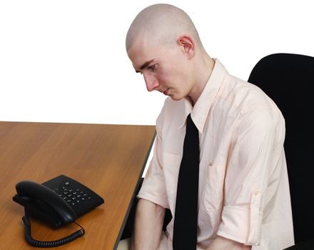 Man sits on easy chair in expectation of telephone call
