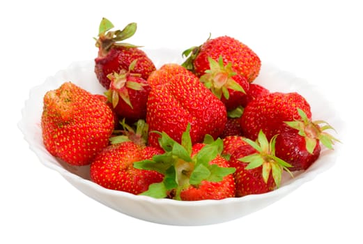 close-up many ripe strawberries on plate, isolated over white background