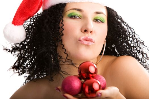 Portrait of the young attractive woman in Santa's hat