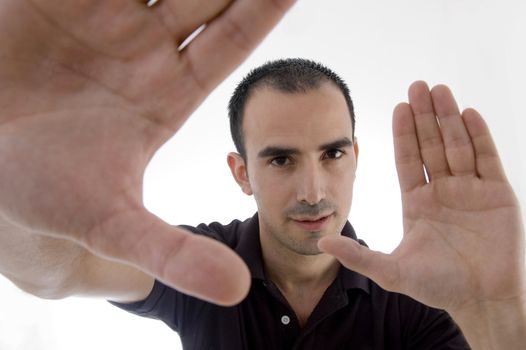 smart pose of young guy with open palms against white background