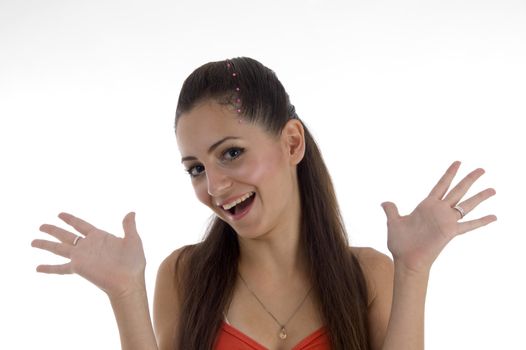 smiling girl showing her palms on an isolated background