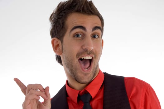 cheerful man pointing backside on an isolated white background