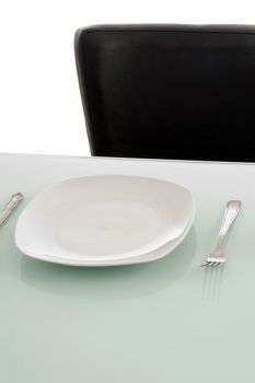 plates on dinning table against white background