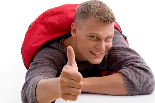 young guy showing thumbs up with white background