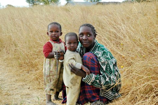 Smiling Masai african family in savana Tanzania, Africa, 15 agust 2004