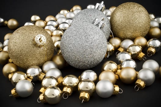 Full pack of silver and golden christmas balls on black