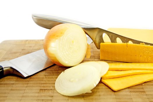 Cheese and Onion with knives on a board