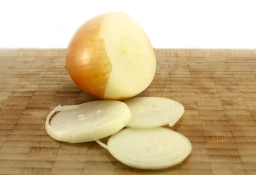 Sliced Onion on a wooden chopping board