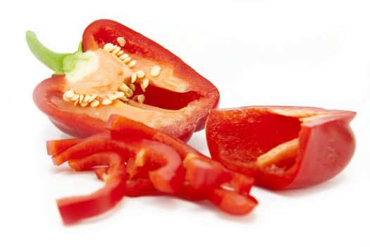Sliced red  bell pepper (background) isolated on a white background