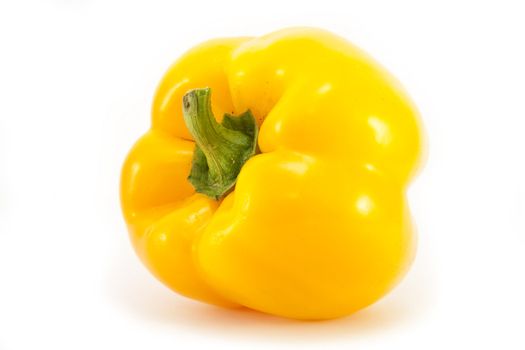 Whole yellow pepper isolated on a white background