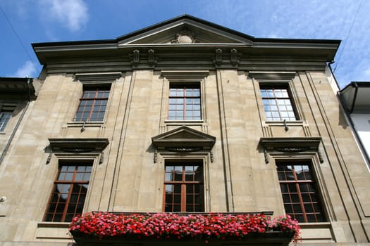 Balcony with flowers in Winterthur, Switzerland. Local landmark in summer.