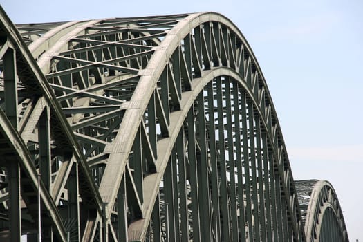 Railway Hohenzollern arch bridge over Rhine river in Cologne, Germany. Suspended deck bridge.