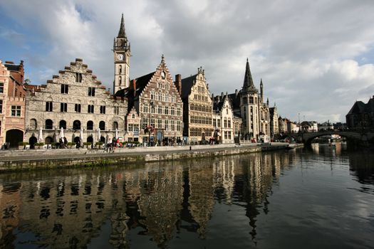 Beautiful Belgian town of Ghent and its reflection in river Leie water