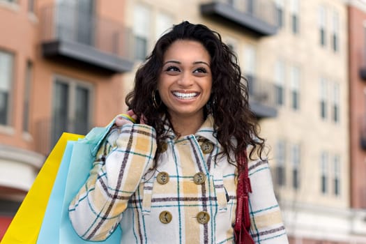 An attractive girl out shopping in the city.